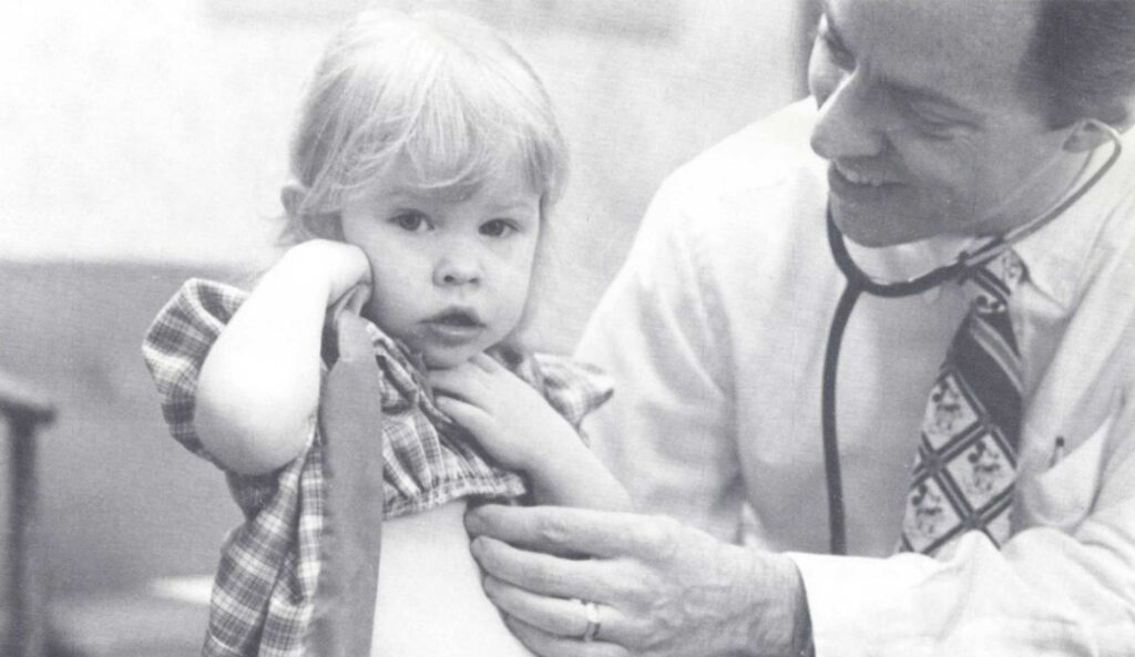 Albany General Hospital clinician with child, 1987