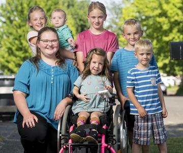 Claire Burrill poses with her siblings — Elizabeth, Maria, Joe, Sam and Nicholas — and friend Kaia Mannale in their neighborhood, where a spark of inspiration turned into something special