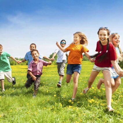 children running outside showing how health screenings can help keep children healthy
