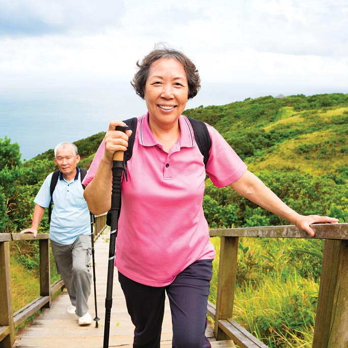 Asian woman and man hiking