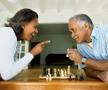 Couple playing a board game.
