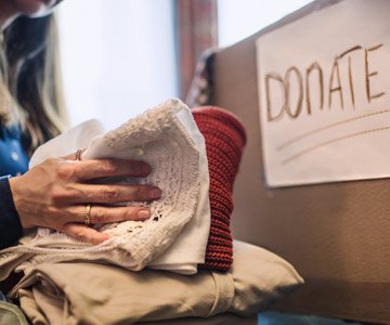 Linens going into a donation box