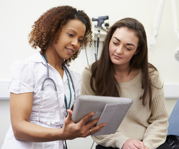 Clinician talking to a teenager.