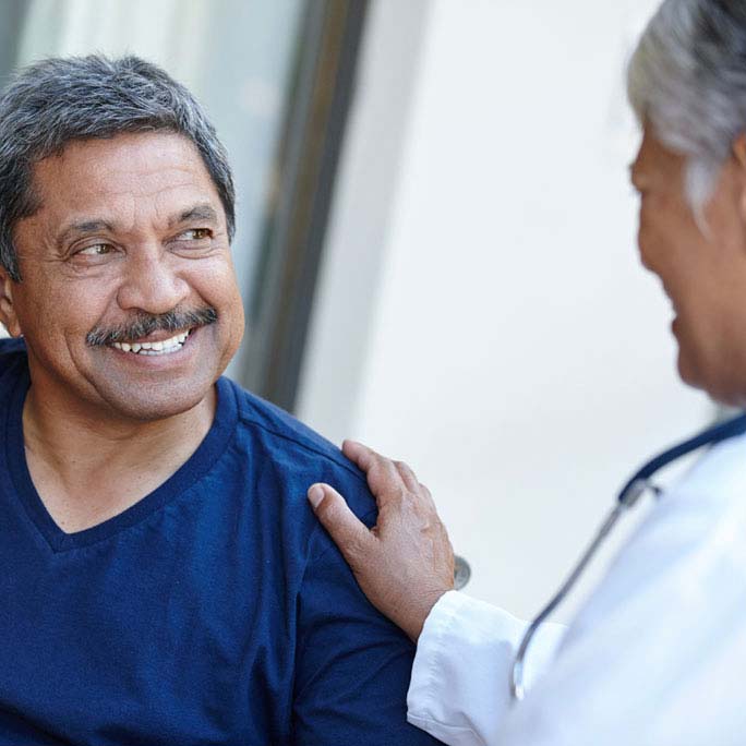 Smiling patient with doctor