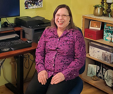 Samaritan database administrator working in her remote home office