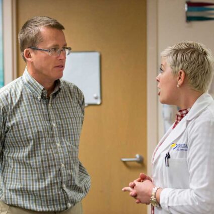 Two people in discussion.