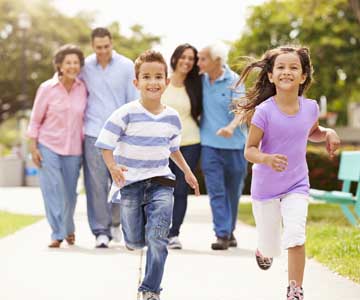 Multi generational family running and happy