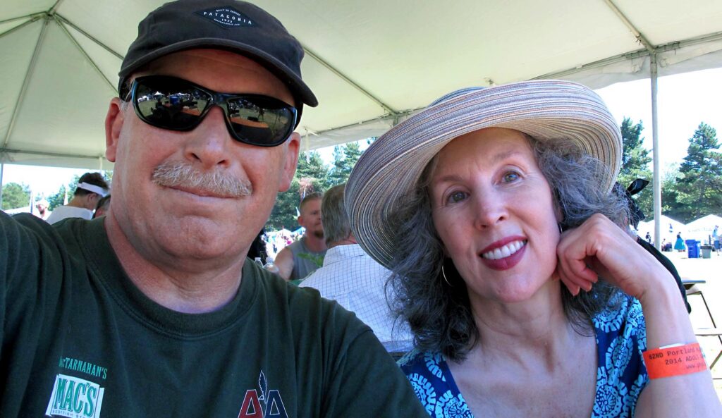 Randall with his sister at an outdoor event.