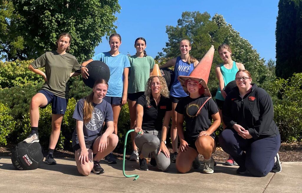 Participants in the Girl's Strength Camp having some fun as they pose for a group picture.