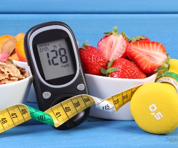 diabetes, glucose meter, tape measure, strawberries