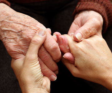 two sets of hands grasping