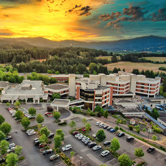 Drone view of Good Samaritan Regional Medical Center at sunset.