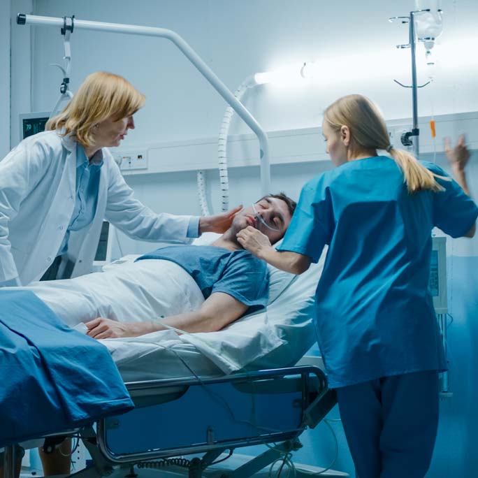 doctor with patient in intensive care unit
