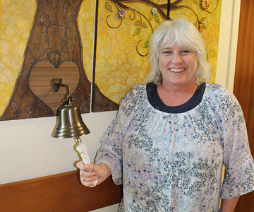 Richelle Burns ringing the bell at the cancer center