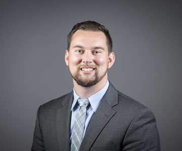 Photo of Loren Tetzlaff smiling.