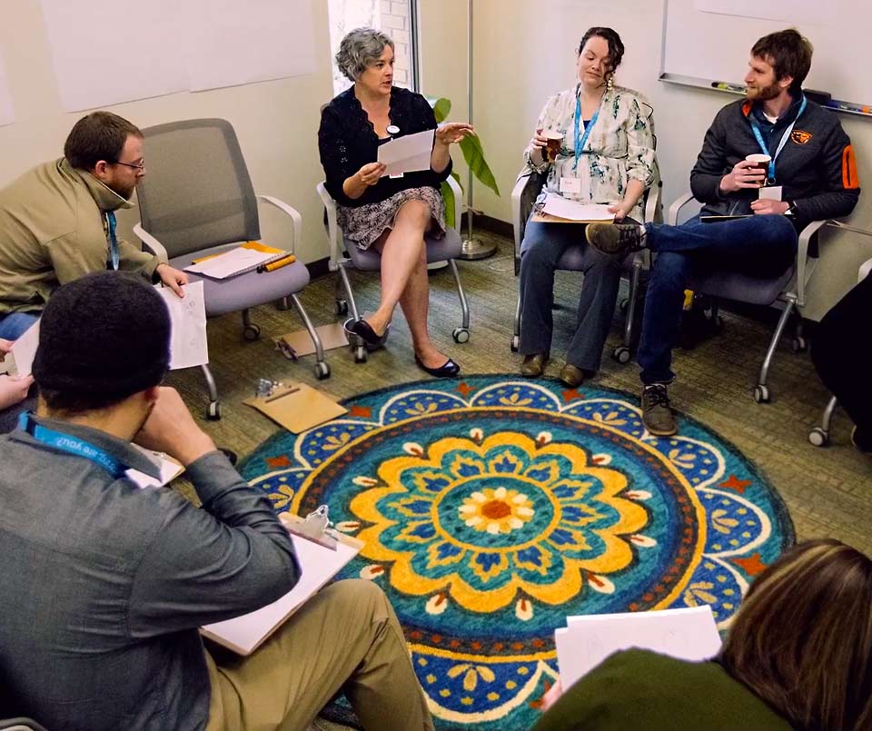 Expecting parents gather at the maternity centering group.