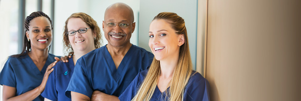 Medical staff in a hallway at a hospital.