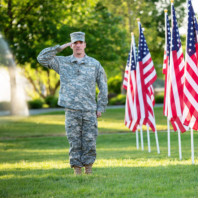Young military man saluting