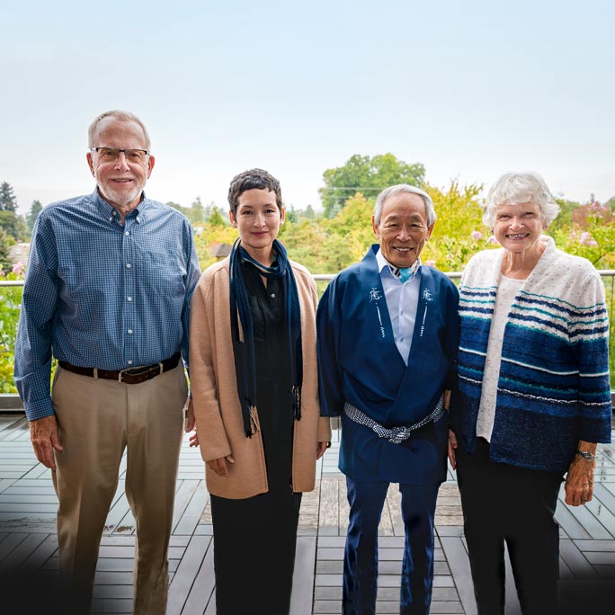 Landscape designer Hoichi Kurisu and his daughter Michiko standing with the Nelsons in front of the Lebanon Japanese Gardens.