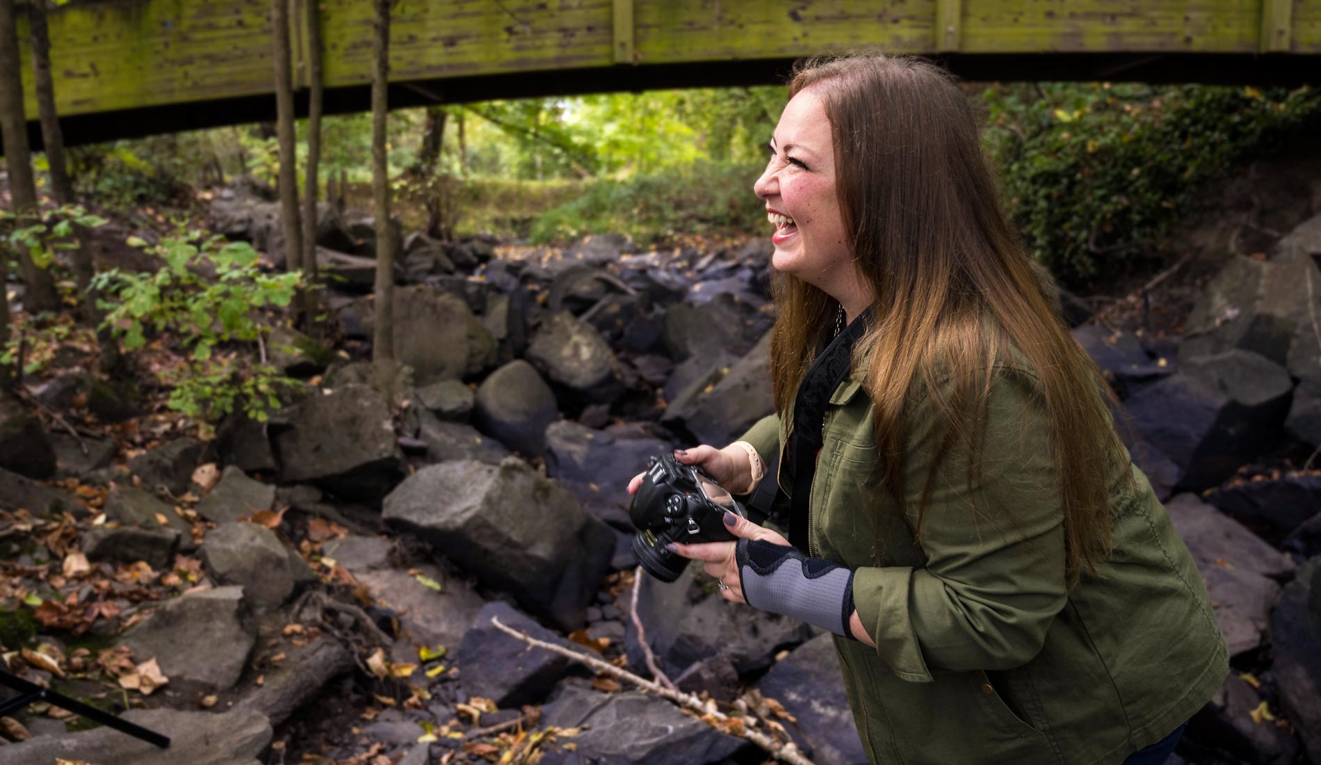 Ashley laughing along with her subject as they take various outdoor pictures.