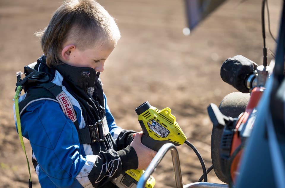 Brody taking a moment to care for his race car.