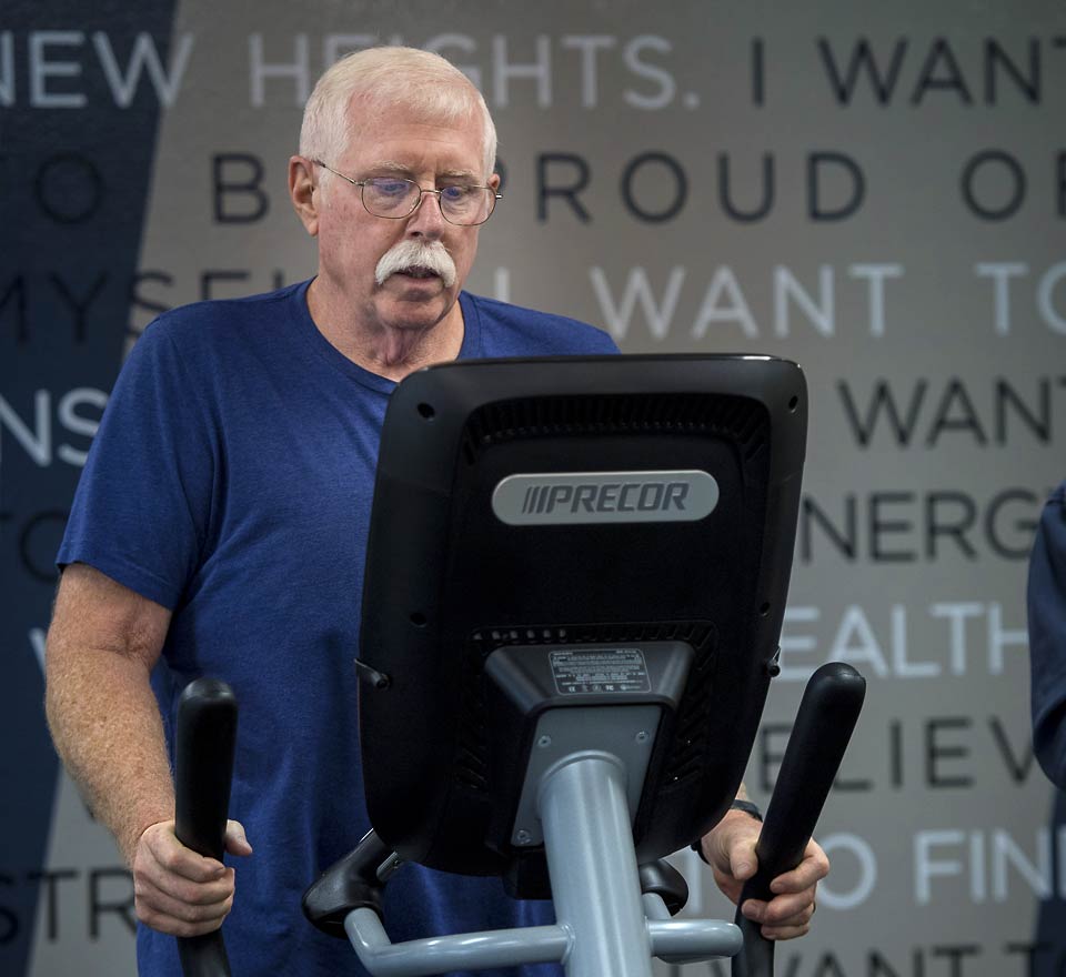 Jim working out on a treadmill.