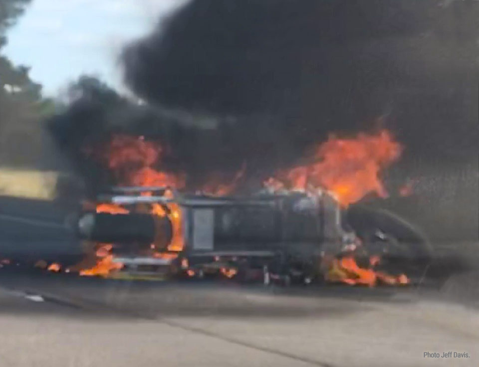Kent's motorcycle engulfed in flames after the crash.