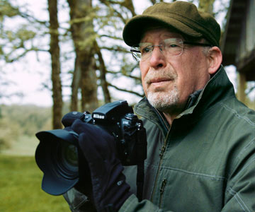 Randall with his Nikon camera enjoys photography in his free time.