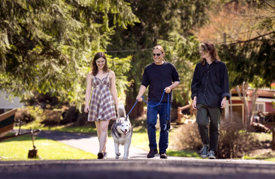 Rik walking with his son and daughter and the family dog.