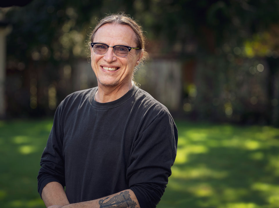 Rik smiling on a sunny day.