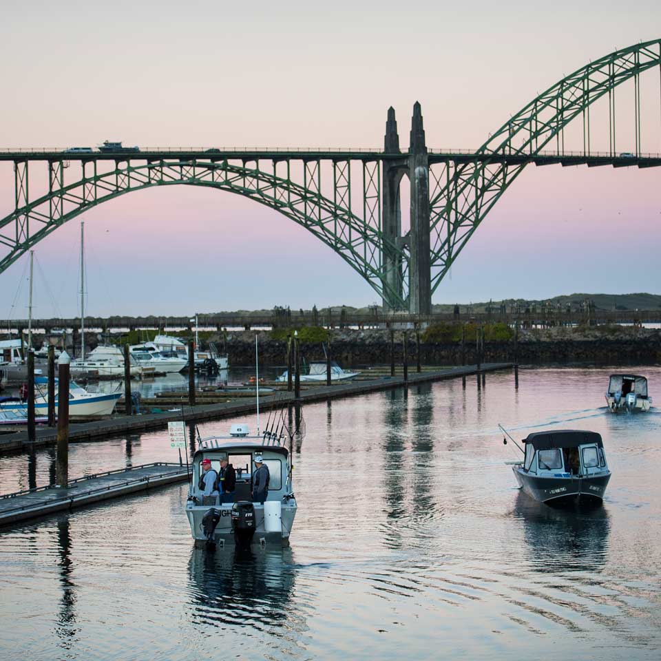 Roger's boat heading out for a day of fishing with the Newport Bay Bridge in the background.