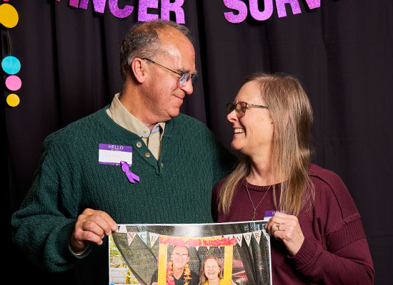 Rob and Donna Durbin smiling at one another at the annual Cancer Survivor's Day event.