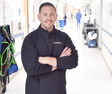 Dr. Robert Wood standing in hallway of hospital.