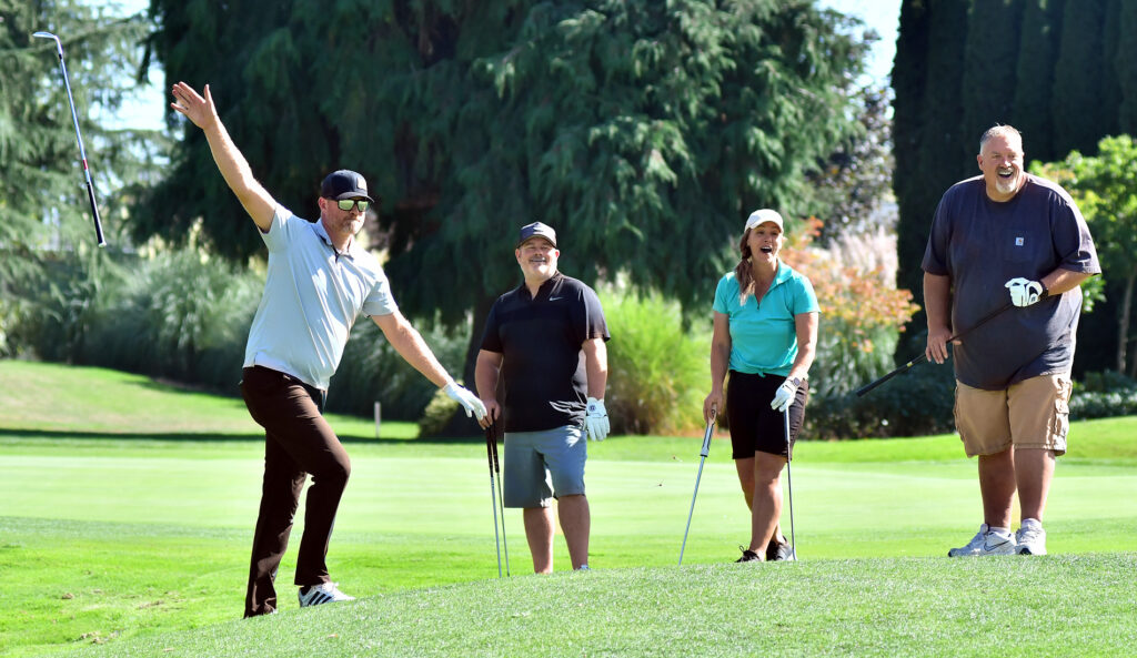 Scott playing golf with his buddies.