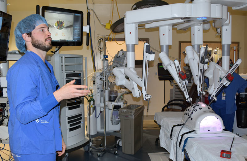 Samaritan Pacific Communities Hospital staff member speaking to team at robotic open house.