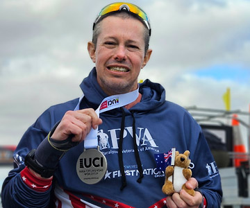 Jeremy VanTress holds up his medals from the Paralympics.