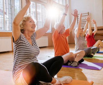 Seniors participating in a group exercise class