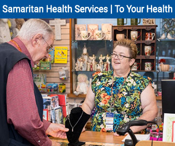 Volunteers at the Samaritan Lebanon Community Hospital gift shop standing at the counter conversing.